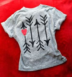 a t - shirt with arrows and hearts on it