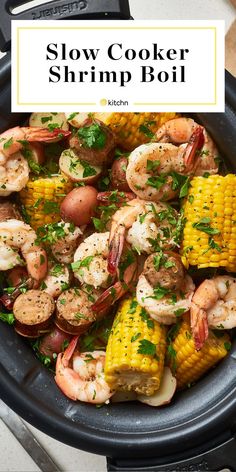 slow cooker shrimp boil in a skillet with corn on the cob and parsley