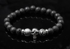 Stainless steel skull bead bracelet with Picasso jasper and volcanic lava stone - cool gift idea for men Unique skull stretch bracelet with Picasso Jasper and Vulcan Lava Stone - Perfect for a cool look and as a cool gift for men who want to emphasize their individual style Immerse yourself in the world of cool and modern jewelry with this unique skull bracelet. It consists of 10 mm faceted Picasso Jasper beads framed in the center by a stainless steel skull bead. Rondelle stainless steel spacer Casual Skull Jewelry For Gifts, Casual Skull-shaped Jewelry For Gifts, Casual Skull-shaped Jewelry Gift, Casual Skull-shaped Gift Jewelry, Skull Real, Bead Frame, Trendy Bracelets, Picasso Jasper, Style Rock