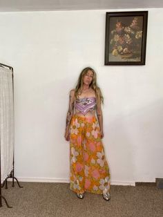 Handmade palazzo pants made from a found vintage 60s deadstock silk fabric in oranges and pinks and sort of a muted chartreuse.  These pants have pockets! and an elastic waistband to accommodate many, Measurements taken flat: Waist: 28" - 38" Hips: 50" Rise: 12" Inseam : 30" Retro Floral Print Bottoms For Vacation, 70s Inspired Wide Leg Summer Pants, Vintage Floral Print Bottoms For Vacation, Hippie Orange Bottoms For Summer, Vintage Bottoms For Beach Season Vacation, Summer Beach Pants In Orange, Retro Spring Poolside Bottoms, Vintage Pink Pants For Summer, Vintage Wide-leg Summer Pants