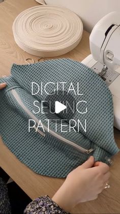 a woman is sewing on a table with the words digital sewing pattern in front of her