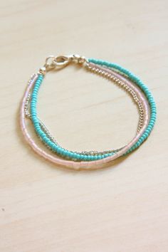 three bracelets with turquoise and pink beads