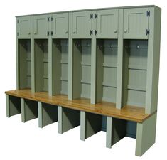 a row of lockers sitting next to each other on top of a wooden shelf