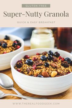 two white bowls filled with granola on top of a wooden table