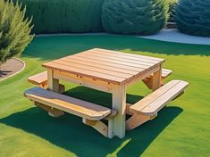 a picnic table with two benches in the grass