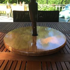 an umbrella on top of a wooden table