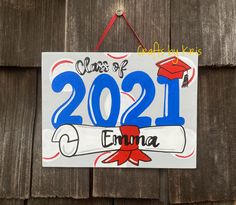 a sign hanging on the side of a wooden fence that says class of 2021 virginia