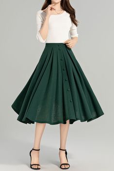 This elegant mid-length skirt is crafted from a beautiful green linen fabric. Whether you're strolling through the city or attending a garden party, this skirt is sure to turn heads with its effortless elegance and style. DETAIL * 50% linen, 50% cotton * Two side pockets * Right zip closure * Button front skirt * Elastic band at the back to provide some stretch * Plus size full skirt * Mid calf length * Perfect for spring, summer * Learn More about the items From the FAQs on the page bottom MODE Glass Clothes, Green Linen Skirt, Linen Skirt Midi, Green Linen Fabric, Stylish Skirts, Hour Glass, Skirt Summer, Summer Linen, Cursed Child