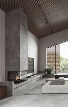 a modern living room with concrete walls and flooring