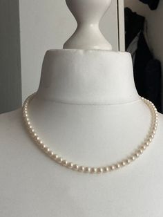 Modernist luminescent cream glass pearl necklace Vintage retro 52cm  single strand row of pearls modernist silver tone clasp Fabulous sheen on glass pearls! Classic Cream Pearl Necklace With Pearl Charm, Classic Cream Necklace With Pearl Chain, Classic Cream Pearl Chain Necklace, Formal Single Strand Cream Pearl Necklace, Cream Pearl Necklace For Formal Occasions, Formal Cream Single Strand Pearl Necklace, Formal Cream Pearl Necklace, Classic Cream Necklaces With Round Beads, Cream Single Strand Pearl Necklace