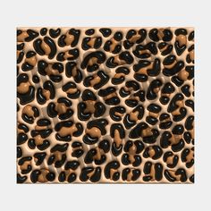 an animal print with black and brown spots