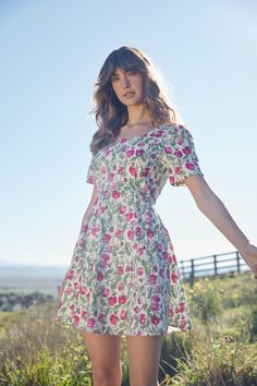 Floral printed mini dress, a gorgeous vine of fragrant flowers, fresh peas & cute bees. This sweet dress has short sleeve, sweet flare and side ties- Fitted bodice with flared skirt - length ends above knee- rounded neckline - short sleeve with slight puff - wide side ties - invisible back zipper - made of a linen viscose blend - available in navy & cream Product Code: PGFY059 Fit And Flare A-line Mini Dress For Garden Party, Summer Ditsy Floral Print Dress With Square Neck, Summer Floral Dress With Ditsy Print And Square Neck, Mid-length Ditsy Floral Dress For Garden Party, Feminine Ditsy Floral Print Dress With Square Neck, Feminine Square Neck Dress With Ditsy Floral Print, Mid-length Floral Print Dress For Garden Party, Floral Print Fit And Flare A-line Mini Dress, Garden Party Ditsy Floral Print Sundress