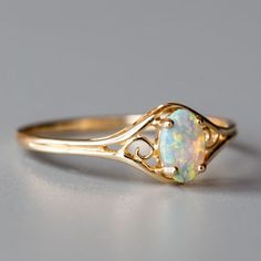 Estilo Vintage Rainbow australiano opal sólida Oval Anillo De Compromiso Oro Amarillo 14K Vintage Opal Birthstone Ring Gift, Vintage 14k Stamped Opal Ring Gift, Antique Yellow Gold Opal Ring, Antique Yellow Gold Opal Ring Gift, Classic Opal Birthstone Ring As Gift, Classic Gift Opal Ring, Heirloom Hallmarked Opal Ring Gift, Black Opal Engagement Ring, Australian Black Opal