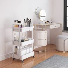 a room with a desk, mirror and stool next to a window in the corner