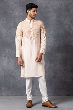 Peach kurta with embroidered motifs on yoke. Comes with churidar.
Components: 2
Fabric: Cotton, Silk
Neckline: Band collar
Sleeve Length: Full
Color: Peach
Embroidery
Lucknowi embroidery
Closure: Front button placket on kurta - Aza Fashions Lucknowi Embroidery, Peach Embroidery, Blouse Yoke, Embroidered Motifs, Silk Kurta, Bespoke Tailoring, Kurta With Pants, Band Collar, Churidar