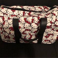 Red Black And White Hello Kitty Duffel Bag On Wheels Black Hello Kitty Widget, Cute Red Shoulder Bag, Red And Black Hello Kitty, Black And White Hello Kitty, Hello Kitty Red Bag For Everyday Use, Cute Red Shoulder Bag With Zipper Closure, Red Hello Kitty Bag For Everyday Use, Red Hello Kitty Print Bag For Everyday Use, Red Hello Kitty School Bag