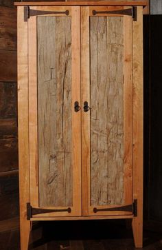 a wooden cabinet sitting on top of a hard wood floor