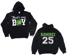 two black hoodies with green and white letters on them, one has a tennis ball that says that's my boy