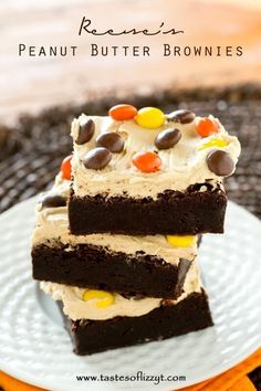 three pieces of peanut butter brownies stacked on top of each other with candy candies