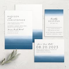 wedding stationery with blue and white ombreed watercolors on the front