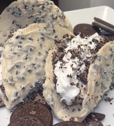 oreo cookies and cream are on a plate