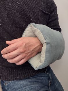 a man with his arm wrapped around an object