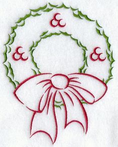 a cross stitch christmas ornament with a bow and number 8 on the front