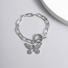 Introducing Our Stunning Butterfly Pendant Chain Bracelet Welcome to our store, where elegance meets affordability! Our Butterfly Pendant Chain Bracelet is a timeless piece that adds a touch of grace to any outfit. Crafted with precision and passion, this bracelet embodies the essence of charm. This bracelet is designed for the modern woman who appreciates beauty and quality. With its straight-line buckle chain and delicate butterfly pendant, it effortlessly blends Korean fashion sensibilities with international appeal. Embrace your femininity with this exquisite piece, perfect for both casual outings and special occasions. Product Features: Chain & Link Bracelet Made of high-quality zinc alloy Charming bowknot design Easy-hook clasp for convenience Available in a stunning silver color Lig Minimalist Alloy Charm Bracelet Gift, Alloy Bracelet With Adjustable Chain, Trendy Alloy Bracelet With Adjustable Chain, Nickel Free Metal Chain Bracelet, Minimalist Alloy Chain Bracelet Gift, Minimalist Alloy Chain Bracelet As Gift, Metal Chain Bracelet For Gift, Adjustable Silver Chain Bracelet In Alloy, Adjustable Alloy Chain Bangle Bracelet