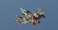 an airplane made out of legos flying in the sky