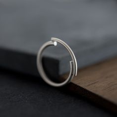 "Essential ring handcrafted from a sterling silver wire of 2mm thick. This minimalist band is the perfect modern design for everyday wear or even for a casual night out, also the best gift for girls who find elegance in simplicity. Available in brushed matte or oxidized black silver finish. ------ HIGH QUALITY We create long lasting, timeless design jewelry handcrafted in Paris with loving attention to details. All AgJc jewelry is made by hand using recycled sterling silver, solid gold or gold f Modern Silver Ring, Architectural Rings, Minimalist Silver Ring, Best Gifts For Girls, Casual Night Out, Modern Ring, Ring Minimalist, Gift For Girls, Silver Gifts