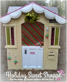 a small toy house with a candy cane door