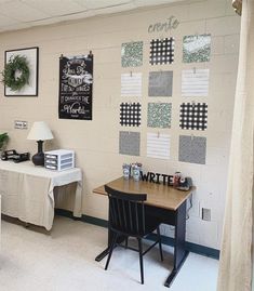 a desk and chair in a room with pictures on the wall above it, along with other decorations