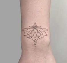 a small tattoo on the ankle of a woman