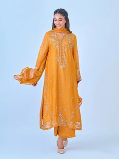 Elegant embroidered cotton net shirt with pants and dupatta a perfect choice for those who appreciate intricate detailing and graceful style. Crafted from high-quality cotton net fabric, this shirt offers a lightweight and luxurious feel, allowing you to feel comfortable and chic throughout the day. The set comes with a matching dupatta and pant which enhances the overall look and adds a touch of finesse to your outfit. Length: 47" Pants Fabric : Raw Silk Dupatta Fabric : Chiffon Unstitched Chanderi Kurta With Dabka Work, Cotton Sharara With Sheer Dupatta For Eid, Traditional Drape Sharara In Cambric With Dabka, Designer Cambric Sharara For Eid, Traditional Drape Cambric Sharara With Dabka, Eid Chanderi Kurta With Dabka Work, Designer Wear Sharara For Eid In Cambric, Mulmul Sets With Resham Embroidery For Eid, Resham Embroidered Straight Kurta Sharara In Cambric