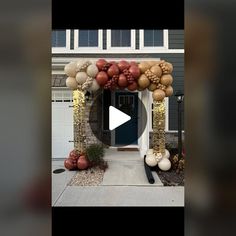 the entrance to a house decorated with balloons