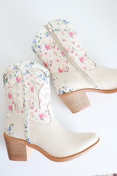 Western style floral boot Flower print and textured upper Braid detail on side Inside Zipper Tapered block heel Boots With Flowers In Them, Floral Cowboy Boots, Boots With Flowers, Cowgirl Barbie, Travel Attire, Shoe Room, Floral Boots, Shoe Wishlist, Senior Prom