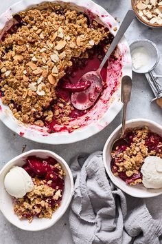 two bowls filled with fruit and topped with ice cream