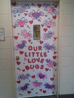 a door decorated with hearts and handprints that says, our little love bugs