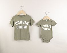 Cousin Crew Shirts and Baby Bodysuits available in Neutral Colors for the Whole Family. *Shirts are Sold Individually so you can mix&match sizes and colors. (For both shirts,  add 2 items to your cart!)  Great for family photos, birthdays, trips, new baby announcements, adoption announcements, holidays and more. ♡ HOW TO ORDER: 1. Select Size and Shirt Color using the drop down menu. 2. Click Add to Cart. Repeat for each item. 3. Once all items are added, click the cart to checkout completed order. ♡ MATERIAL: - Soft, quality Bella&Canvas brand baby bodysuits and Tshirts - Solid Colors: 100% Airlume combed and ring-spun cotton - Heather Colors: Airlume combed ringspun cotton and polyester blended - Triblend Colors: cotton/polyester/rayon blended - Retail Unisex Fit. Scroll through for size Family Matching Short Sleeve Tops For Playwear, Adoption Announcements, Cousin Crew Shirts, Cousin Shirts, Cousin Crew, Single Shirt, New Baby Announcements, Baby Announcements