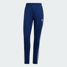 adidas Adicolor SST Track Pants - Blue | Women's Lifestyle | adidas US Spring Sportswear Bottoms With Side Stripes, Blue Sportswear Joggers With Three Stripes, Sporty Blue Joggers With Three Stripes Branding, Blue Three Stripes Joggers Sportswear, Blue Sweatpants With Three Stripes For Streetwear, Casual Blue Joggers With Three Stripes, Adidas Jogging Bottoms With Three Stripes, Blue Sports Joggers With Three Stripes Branding, Blue Sporty Joggers With Three Stripes