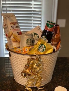 a starbucks gift basket with coffee, cookies and candy