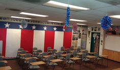 an empty classroom with american decorations hanging from the ceiling