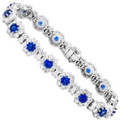 "18K" stamped gemstone bracelet consisting of 16 natural round shaped blue Ceylon sapphires with total weigh 6.10 carats and surrounded by 2.10 carats natural round brilliant cut diamonds. White Gold Diamond Bracelet, Flexible Bracelet, 18k Gold Bracelet, Bracelet Tennis, White Gold Sapphire, Ceylon Sapphire, Bracelets Gold Diamond, Blue Sapphire Diamond, White Gold Bracelet