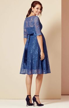 The fun, floaty shape of our Flossie maternity party dress makes it perfect for parties. Cut from premium corded blue floral lace and lined with contrasting dusky blue jersey. The adorable vintage touches are in abundance, from the scallop edging to the stylish ¾ sleeves – to smooth and flatter hips and bump. The perfect dress to see you through a stylish engagement during pregnancy, finish at the waist with a glorious French Blue satin sash (sold separately) to cinch you beautifully. Sweetheart Blue Lace Trim Dress For Garden Party, Blue Lace Dress With Lace Bodice For Spring, Blue Fitted Lace Patchwork Dress, Blue Knee-length Dress With Lace Patchwork, Fitted Summer Maternity Dress With Lace Trim, Elegant Short Sleeve Lace Maternity Dress, Fitted Blue Scalloped Lace Dress, Blue Lace Dress With Lace Patchwork, Blue Lace Patchwork Dress