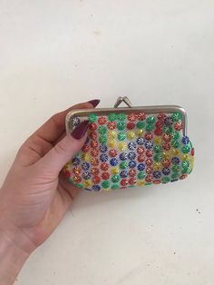 Vintage multicolored coin purse with bright colored floral beads. Metal coin purse clasp. Multicolor Beaded Pouch Coin Purse, Handmade Vintage Multicolor Coin Purse, Multicolor Beaded Coin Purse Pouch, Handmade Multicolor Clutch Coin Purse, Multicolor Beaded Rectangular Coin Purse, Everyday Multicolor Beaded Coin Purse, Vintage Multicolor Rectangular Coin Purse, Retro Multicolor Coin Purse As Gift, Vintage Multicolor Coin Purse As Gift