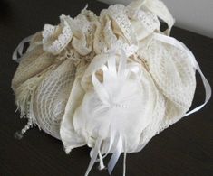 Handmade Boho Bag, Wedding Bag, Vintage White Vintage Lace, OOAK.   The bag is made of hand-knitted white cotton lace. The bag is a complete circle with the lining.    The lining is made of white silk antique fabric with embossed floral motifs. The bag has two inner pockets. It is decorated with a silk tassel and a textile brooch with flowers. Made of silk fabric, tulle, lace, glass pearls and crystal beads and silk ribbons.    The bag closes, ie drapes with silk satin white strips. The bag is c Handmade Elegant Crochet Bag For Wedding, White Crochet Pouch Bag Gift, White Crochet Pouch Bag As Gift, Elegant Handmade Crochet Bag For Wedding, Elegant Crochet Pouch Bag For Wedding, Elegant White Handmade Crochet Bag, Elegant Crochet Wedding Bags, Handmade Crochet Pouch Bag For Wedding, Textile Brooch