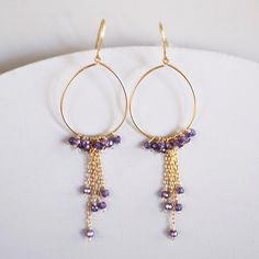 "FREE SHIPPING on our delicate, extremely lightweight amethyst hoop earrings. Entirely handmade. These make great graduation gifts, birthday gifts or gifts for mom. - Amethyst gemstones - 2.75\" long - French hooks - 14k gold plated fine Italian silver - Made in the USA in our New York City studio - Arrives in a gift box Our unique plating technique is designed to be tarnish resistant. The natural shapes of gemstones make each pair one-of-a-kind. Follow us on INSTAGRAM www.instagram/parkenjewelr Purple Round Hoop Earrings As Gift, Purple Round Hoop Earrings For Gift, Elegant Small Hoop Purple Earrings, Everyday Purple Jewelry With Ear Wire, Elegant Purple Small Hoop Earrings, Purple Dangle Hoop Earrings As Gift, Purple Hoop Earrings As Gift, Small Purple Hoop Earrings As A Gift, Amethyst Hoop Earrings With Ear Wire, Gift