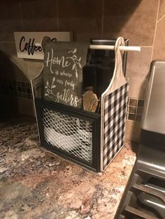 a kitchen counter with a black and white basket on top of it next to a stove