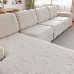 a living room with a large white couch