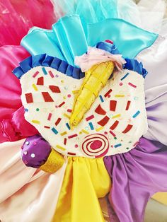 This Katy Perry Inspired Candy Land Dress is made of high quality sequin fabric, satin and tutu. We sew candies and ice cream on top of the dress and this fabulous dress has hangers, and the hangers form the ribbon on the back of the dress.. We use sequin fabric front of the top and sew on the fabric ice cream, candies and cake so your daughter will look sweetie when she wear this striking dress.. We use satin and tutu for the skirt part of the dress, there is colorful tutu under the colorful sa Toddler Ice Cream, Candy Outfit, Ice Cream Dress, Pebbles Costume, Prince Costume, Red Riding Hood Costume, Candy Dress, Ice Dresses